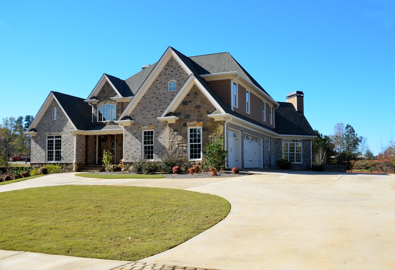 Luxury suburban home with a clean concrete driveway